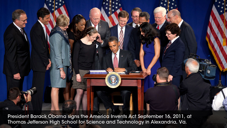 President Barack Obama signs the America Invents Act September 16, 2011, at Thomas Jefferson High School for Science and Technology in Alexandria, Va.